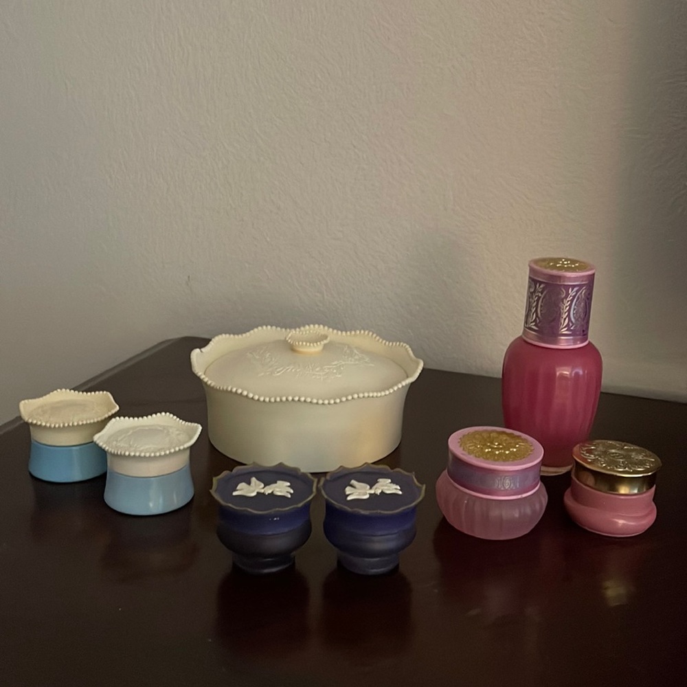 Collection of vintage Avon perfume cream and powder containers